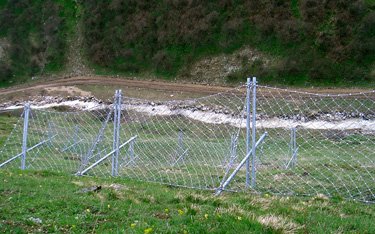 Rock fall protection screens are designed for use with large boulders